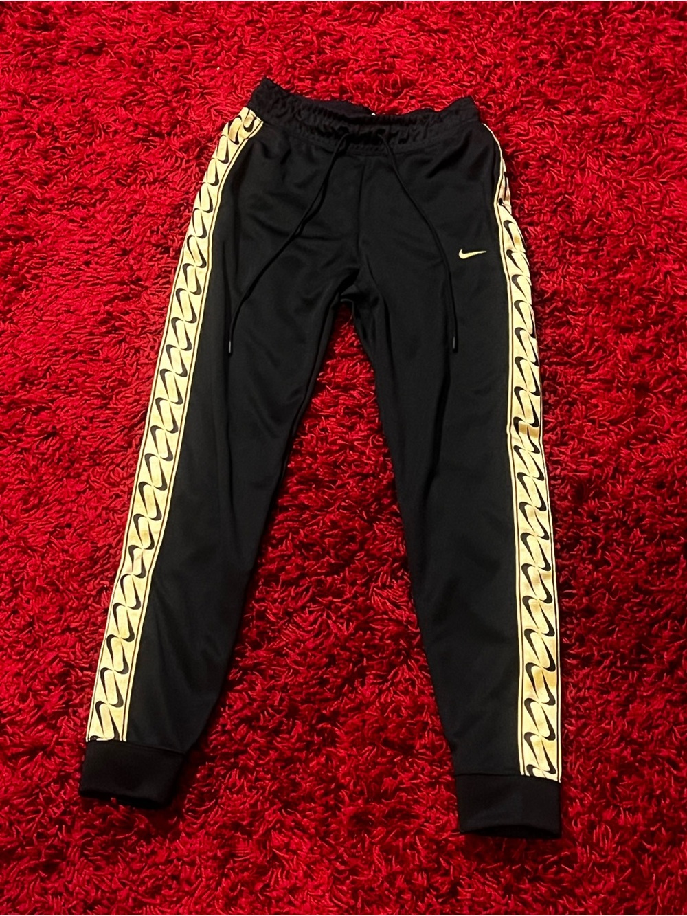 Brand new Woman’s Nike Black Joggers with gold Accent Side Stripe extra small